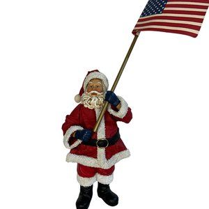 Possible Dreams Santa Clothtique God Bless America holding flag of USA